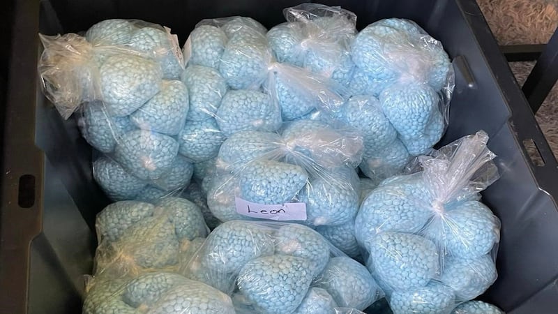 This photo provided by the U.S. Drug Enforcement Administration shows pills containing...