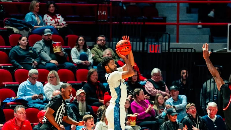 Liberty's JJ Harper launches a successful three-point shot at Western Kentucky.