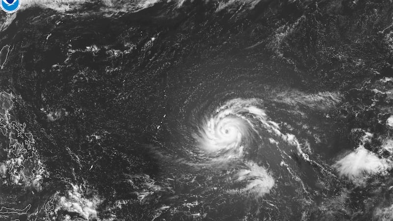 This satellite image from the National Oceanic and Atmospheric Administration shows Typhoon...
