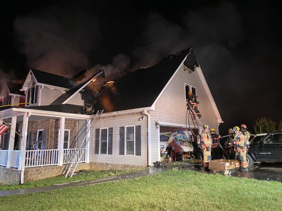 Personnel said they witnessed heavy fire coming from the rear of a large two-story home with a...