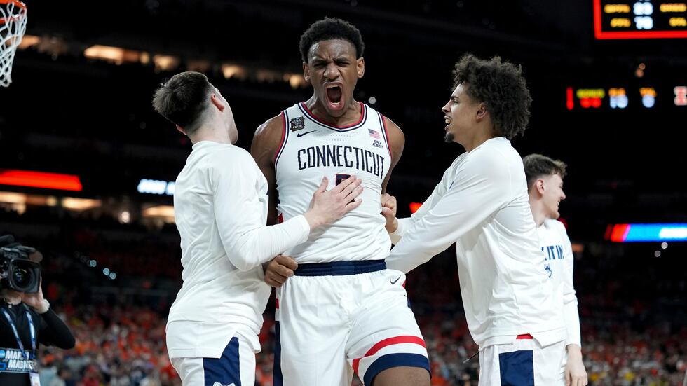 UConn forward Tarris Reed Jr., center, celebrates after the second half of an NCAA college...