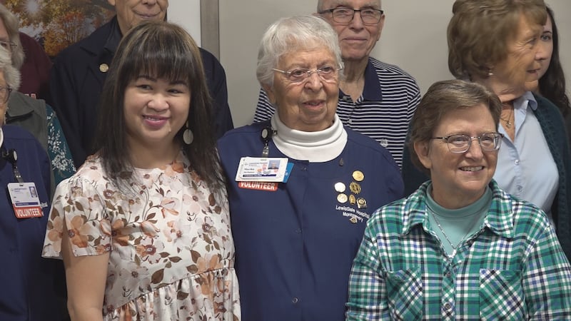 Martha McMahan poses with past and present volunteers at LewisGale Montgomery Hospital, where...