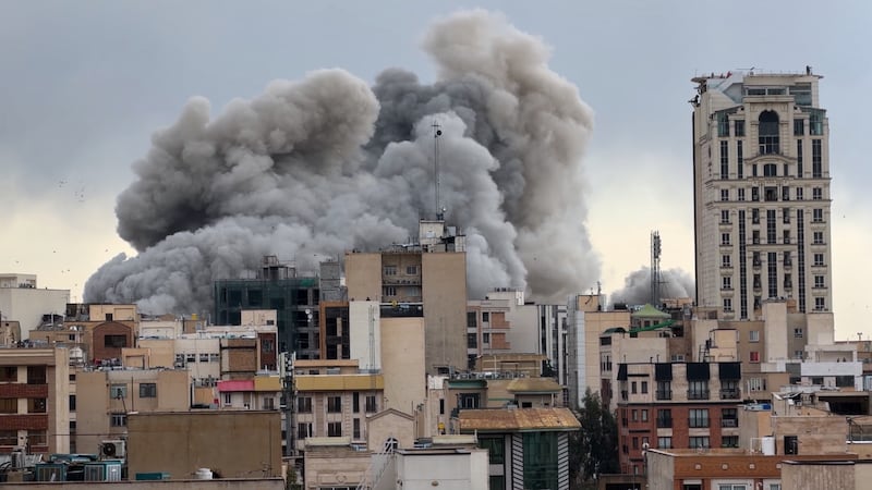 A plume of smoke rises after a strike in Tehran, Iran, Monday, March 2, 2026.