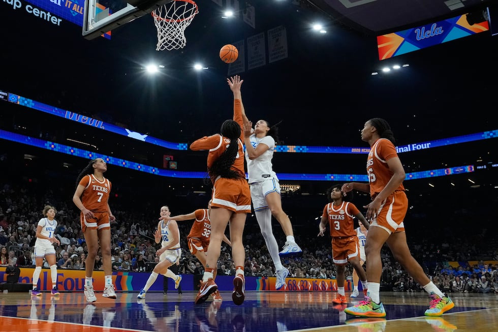 UCLA center Lauren Betts (51) shoots against Texas during the first half of a women's NCAA...