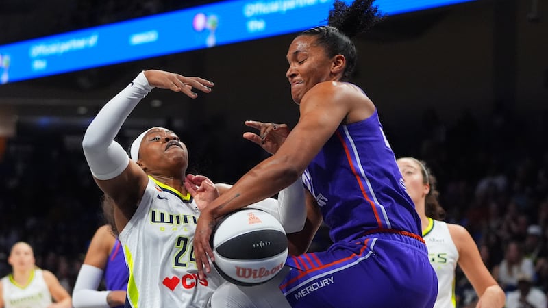 Phoenix Mercury forward Alyssa Thomas (25) strips the ball from Dallas Wings guard Arike...