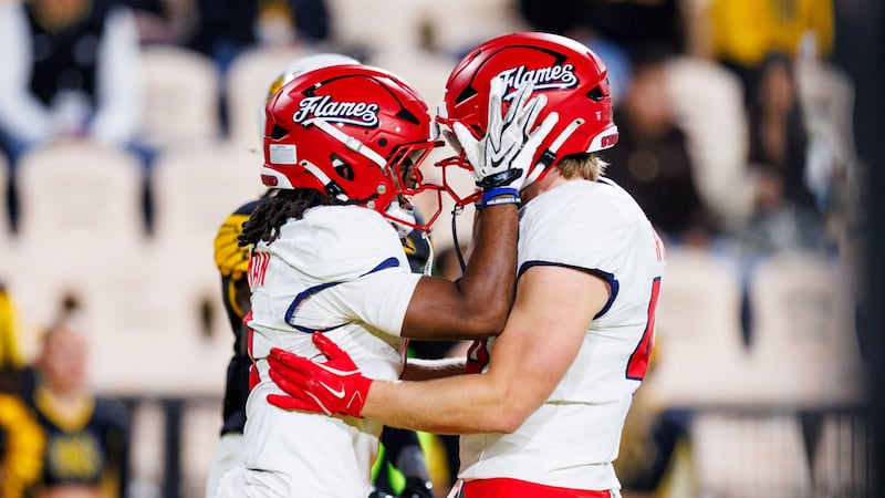 Liberty celebrates a touchdown in the Flames' 34-6 win over Kennesaw State.
